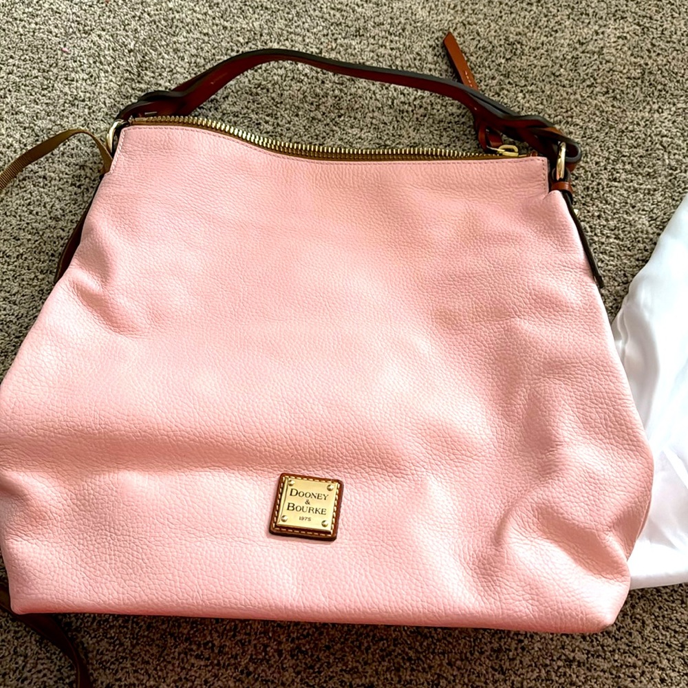 Large dooney and bourke 1975 never used but no tags price firm size 15x16x7